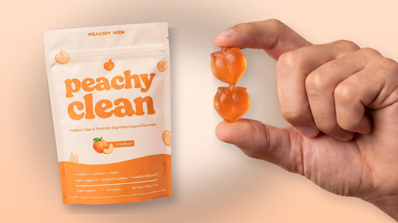 Hand holding two Peachy Clean gummies next to the Peachy Clean bag